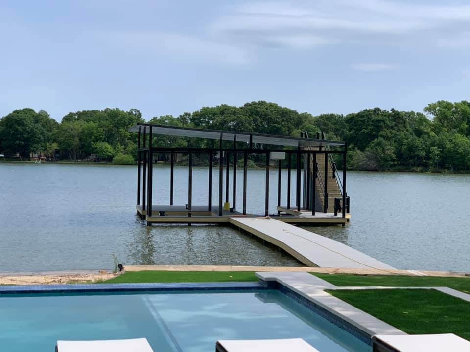 A custom boat ramp and deck pictured with stairs